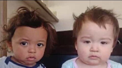 Baby twins trapped inside cupboard