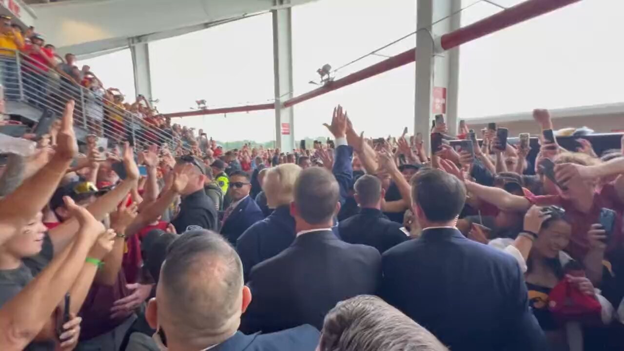 The Iowa State University crowd chants “USA, USA, USA,” as President Trump walks through.