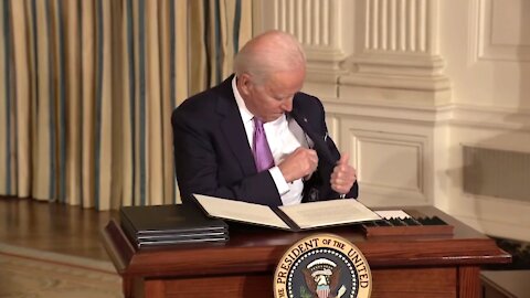 Biden Struggles To Put Pen In His Pocket