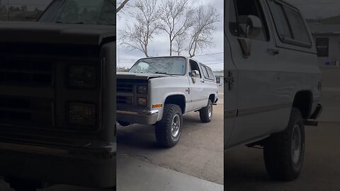 Restored Chevy Blazer Classic 4x4 driving out of the shop