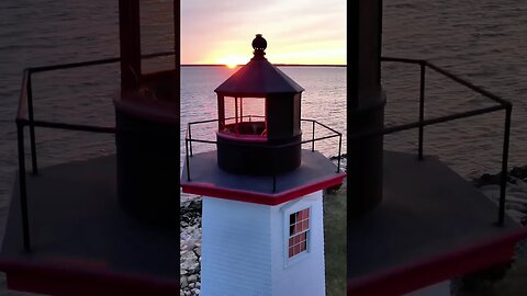 Peaceful sunset flight at Wings Neck Lighthouse