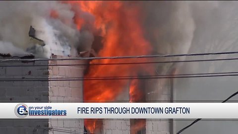 Firefighters battle large fire as building collapses in downtown Grafton