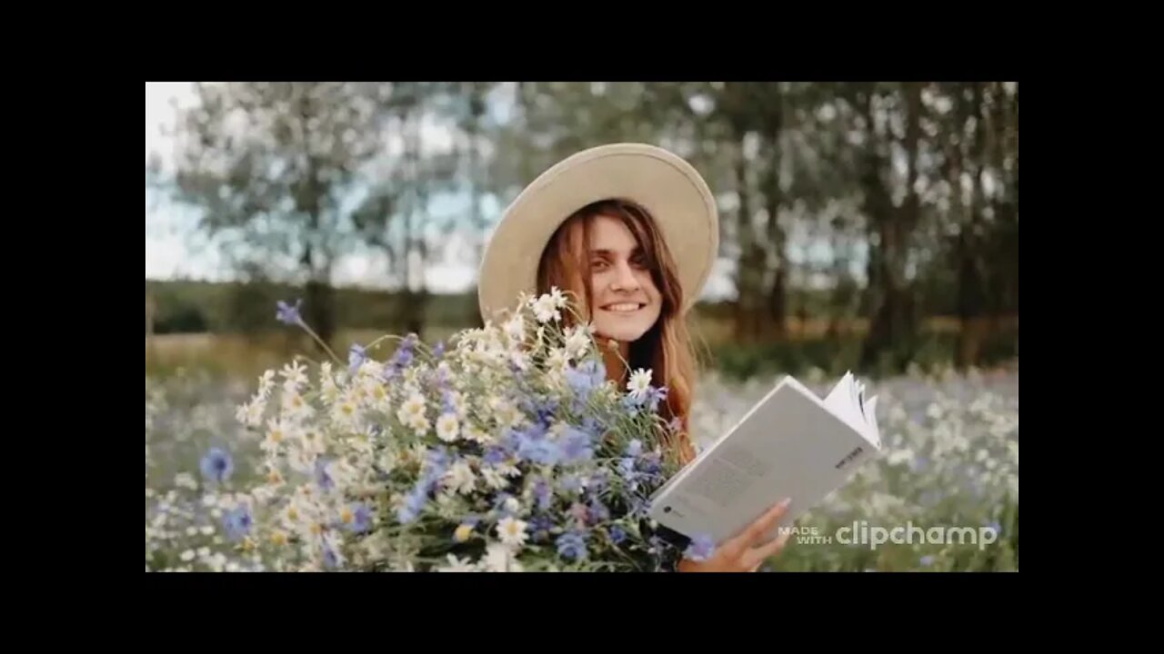 A Woman Reading A Book with Flowers On Hand