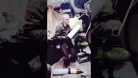 Ukrainian solider loads Vulcano 155mm satellite guided artillery projectile