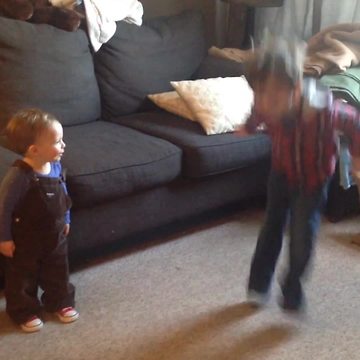 A Big Brother Teaches The Younger One How To Jump