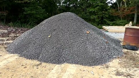More gravel coming in and plans for the building.