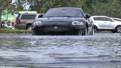 West Boca drenched by heavy rain, flooding parking lots