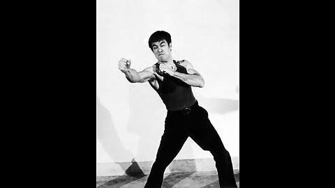 Cross kick Studio Films Bruce Lee picture in his Dojo
