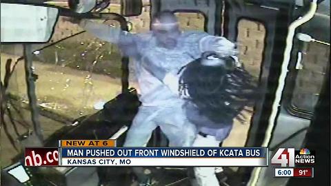 Video shows man pushed through city bus window