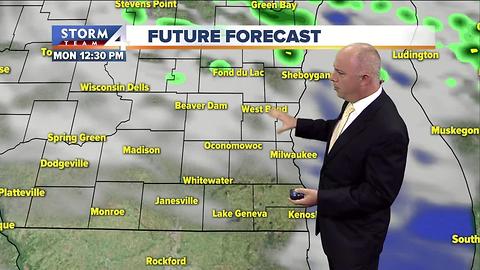 Cooler Sunday with scattered afternoon showers