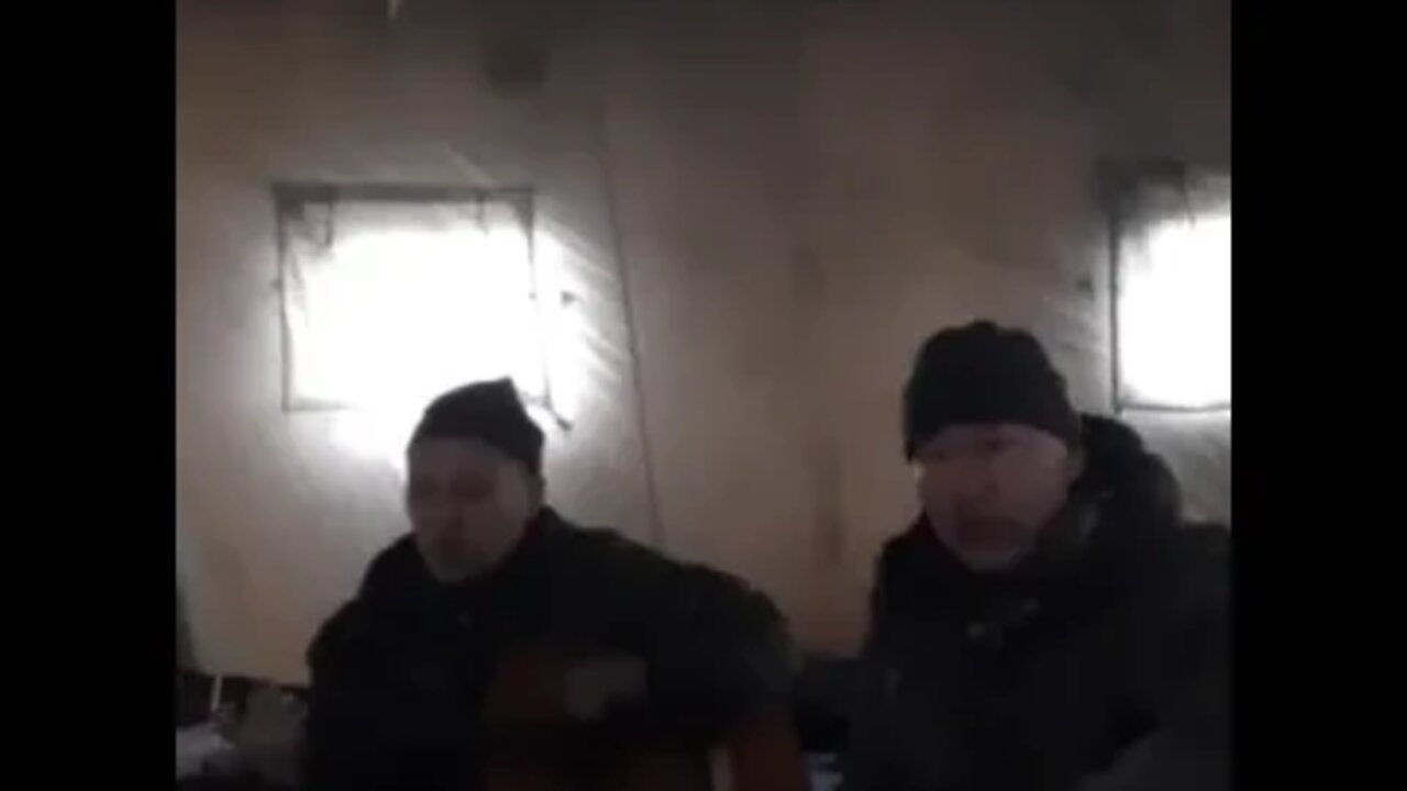 Russian soldiers rest and sing between battles