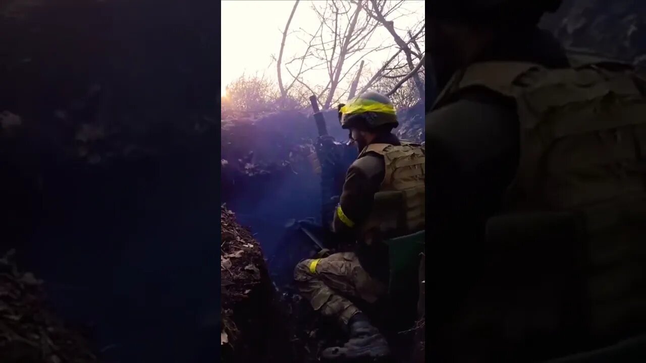 Ukrainian soldier firing a Russian AGS-17 grenade launcher at a very high angle