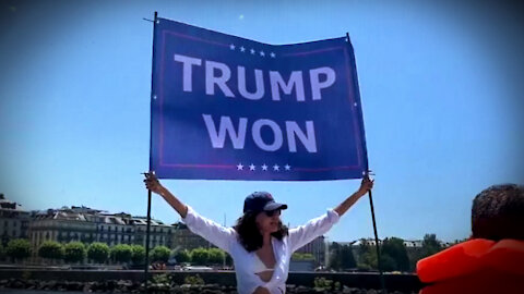 Infowars Reporter & Noor Bin Ladin Nearly Arrested For Waving Trump Flag Outside Biden/Putin Summit