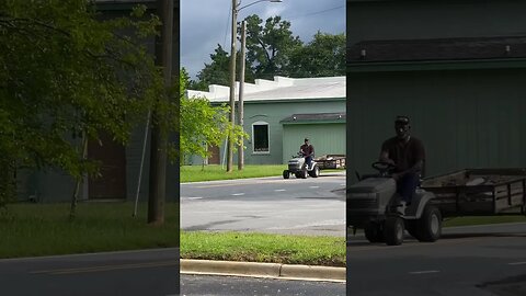 Lawn mower driving down the road towing a trailer #southern pride [God bless America]