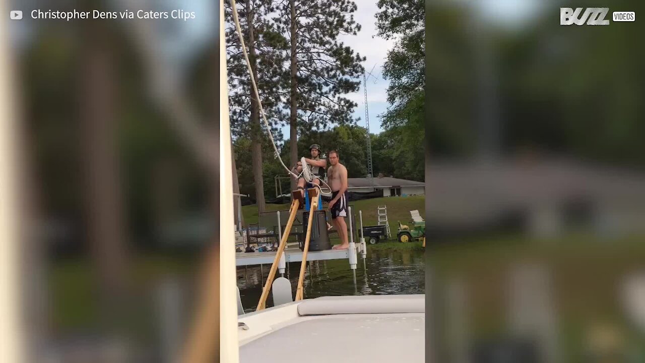 Crazy guy water skis on stilts