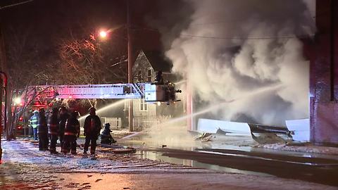 Cleveland firefighters battled a 3-alarm fire inside a commercial building that sent smoke for miles
