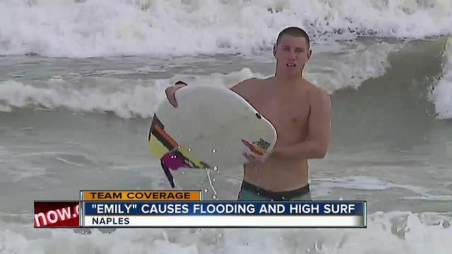 Beachgoers brave rough surf