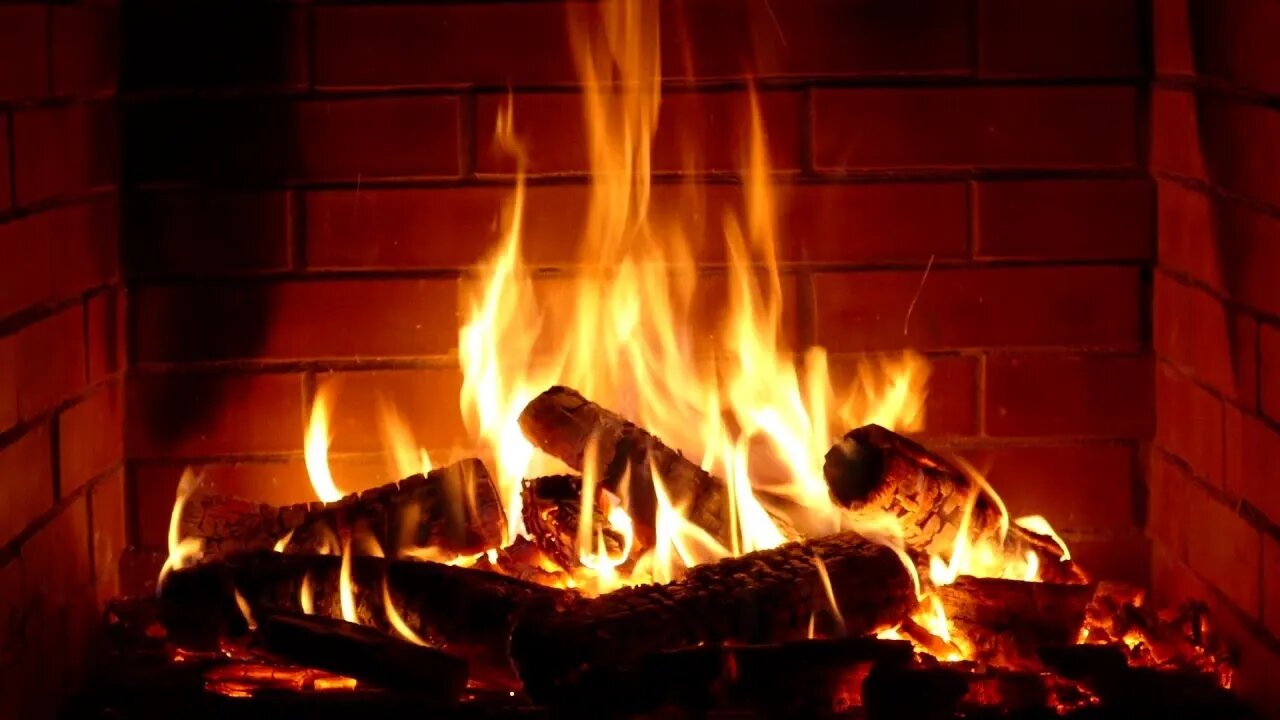 Peace in a winter night in front of the fire in a wooden house with the sound of rain