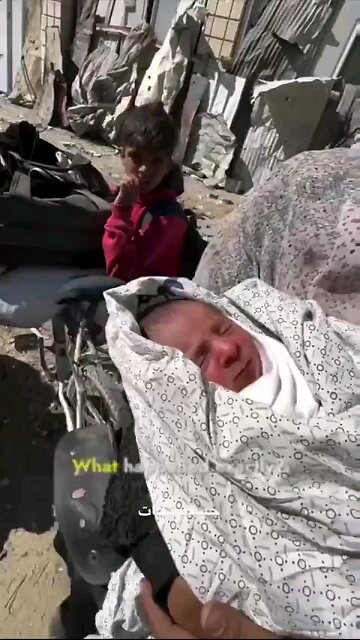 This baby was found in the streets after his mother was killed by Israel.
