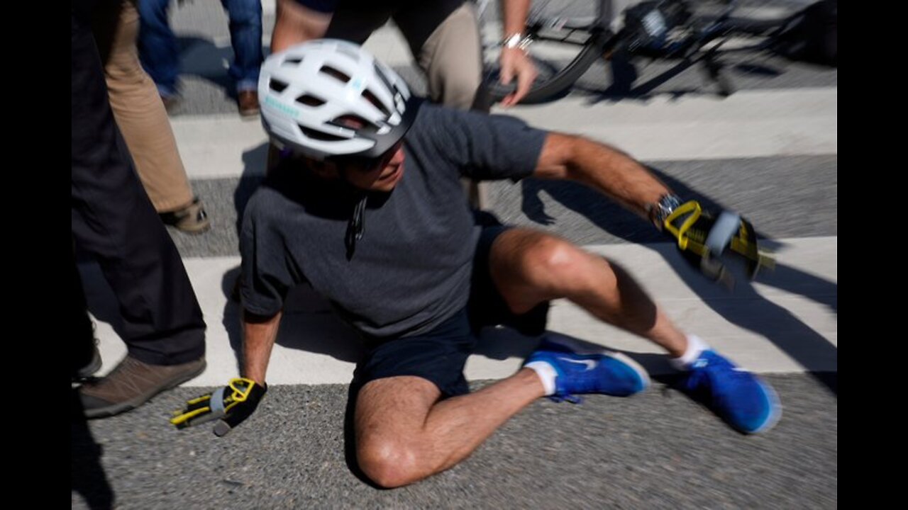 Joe Biden crashes a bike while riding up to members of the public during a bike ride