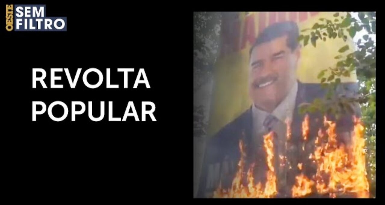 Protesters in Venezuela set fire to billboard with photo of dictator Maduro