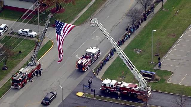Procession for fallen Greenfield firefighter travels under Garrison