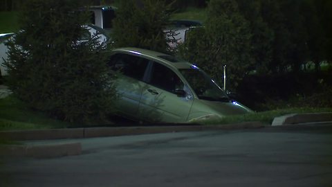 Man arrested after dangling from sign on I-77 overpass, assaulting girlfriend and hotel clerk