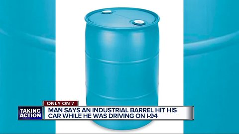 Man says an industrial barrel hit his car while he was driving on I-94