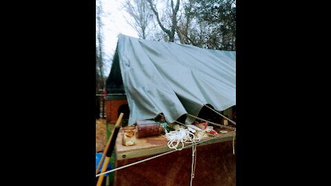 Rebuilding the canopy over camp