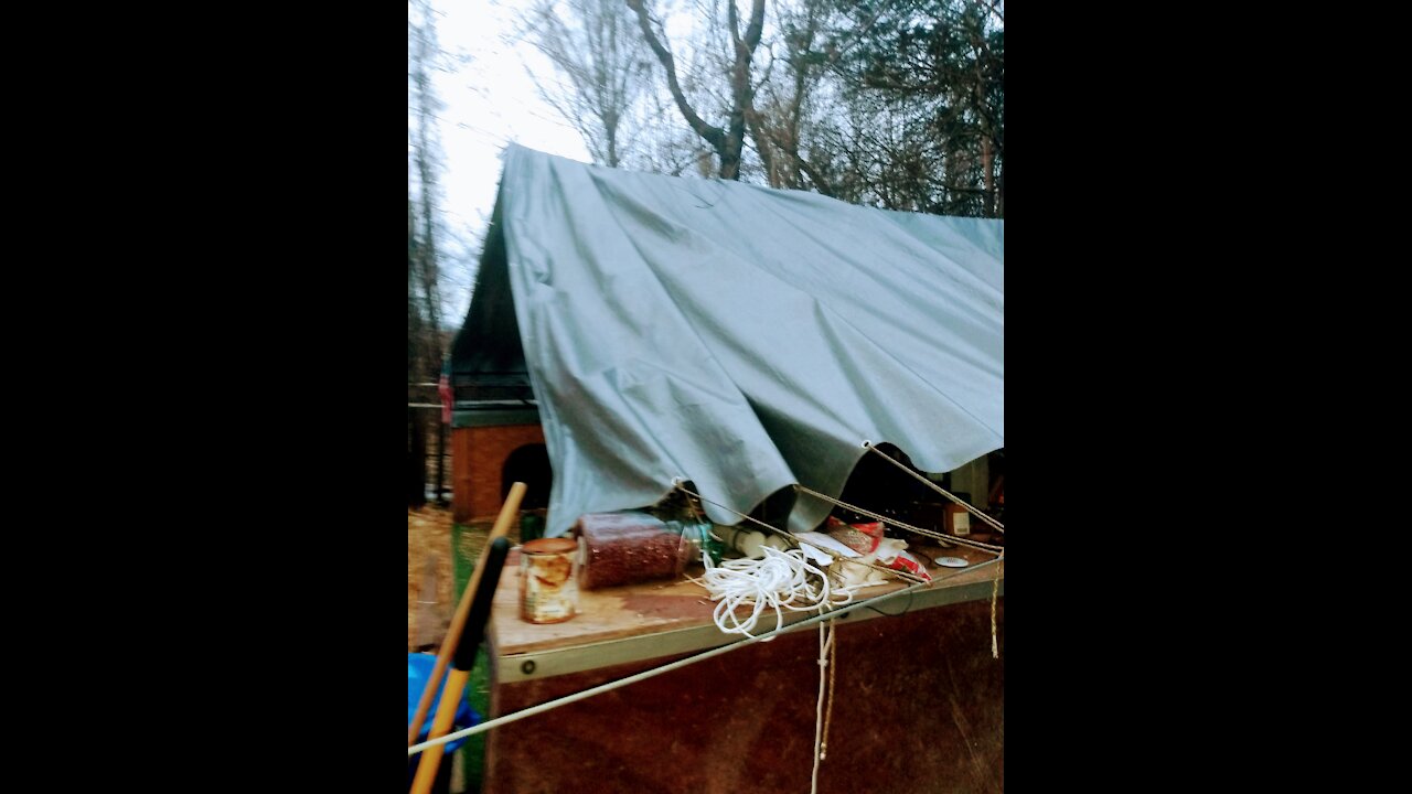 Rebuilding the canopy over camp