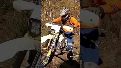 Over a log, helping others!