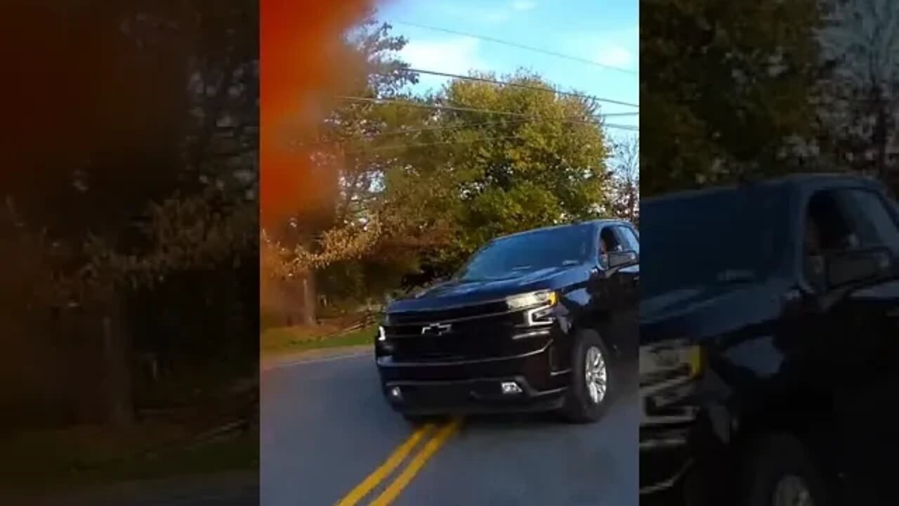 Motorcycle close call. Truck cuts corner narrowly missing rider.