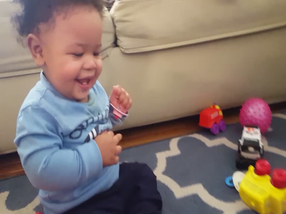 Baby gets a Case of the Giggles when Playing with Toy