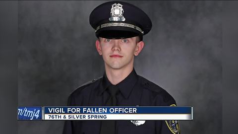 'He didn’t give his life in vain': Vigil for fallen officer draws large crowd