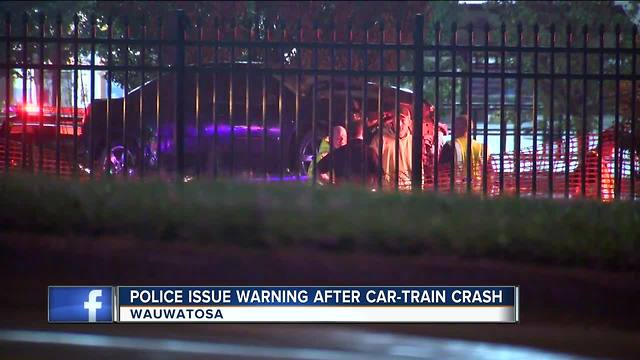 Driver and child stuck on Tosa train tracks had "minutes" to leave area before train arrived