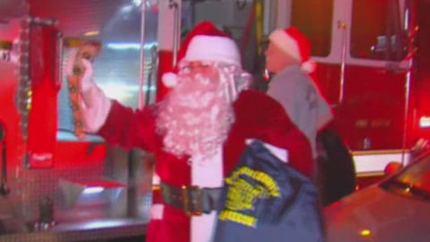 Firefighters deliver presents to suburban Lake Worth family after fire