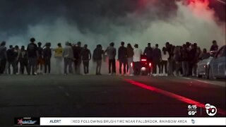 Large crowds gather as cars do donuts in Lincoln Park