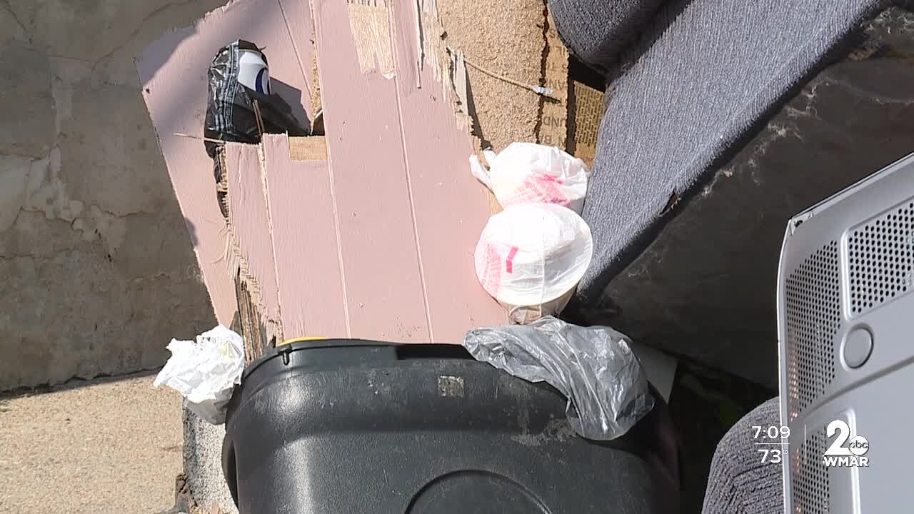 Neighbors target vacant property that's turned into a trash pad