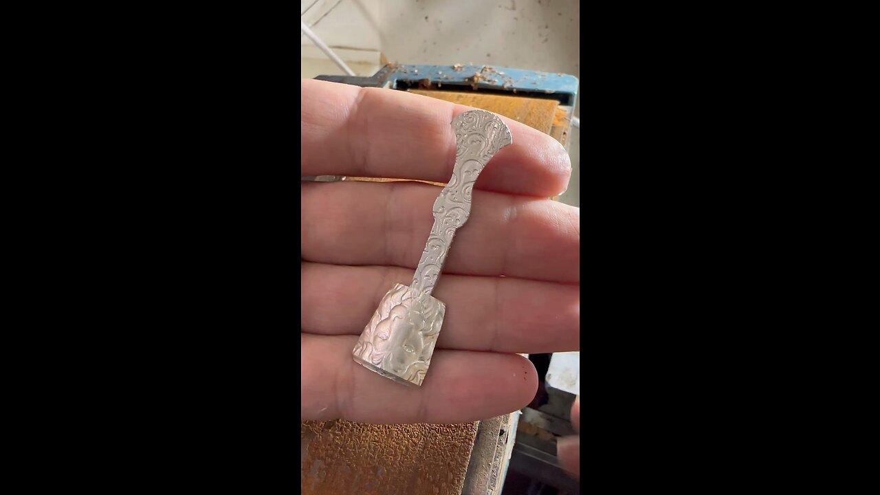 Fitting the spring to the peg 