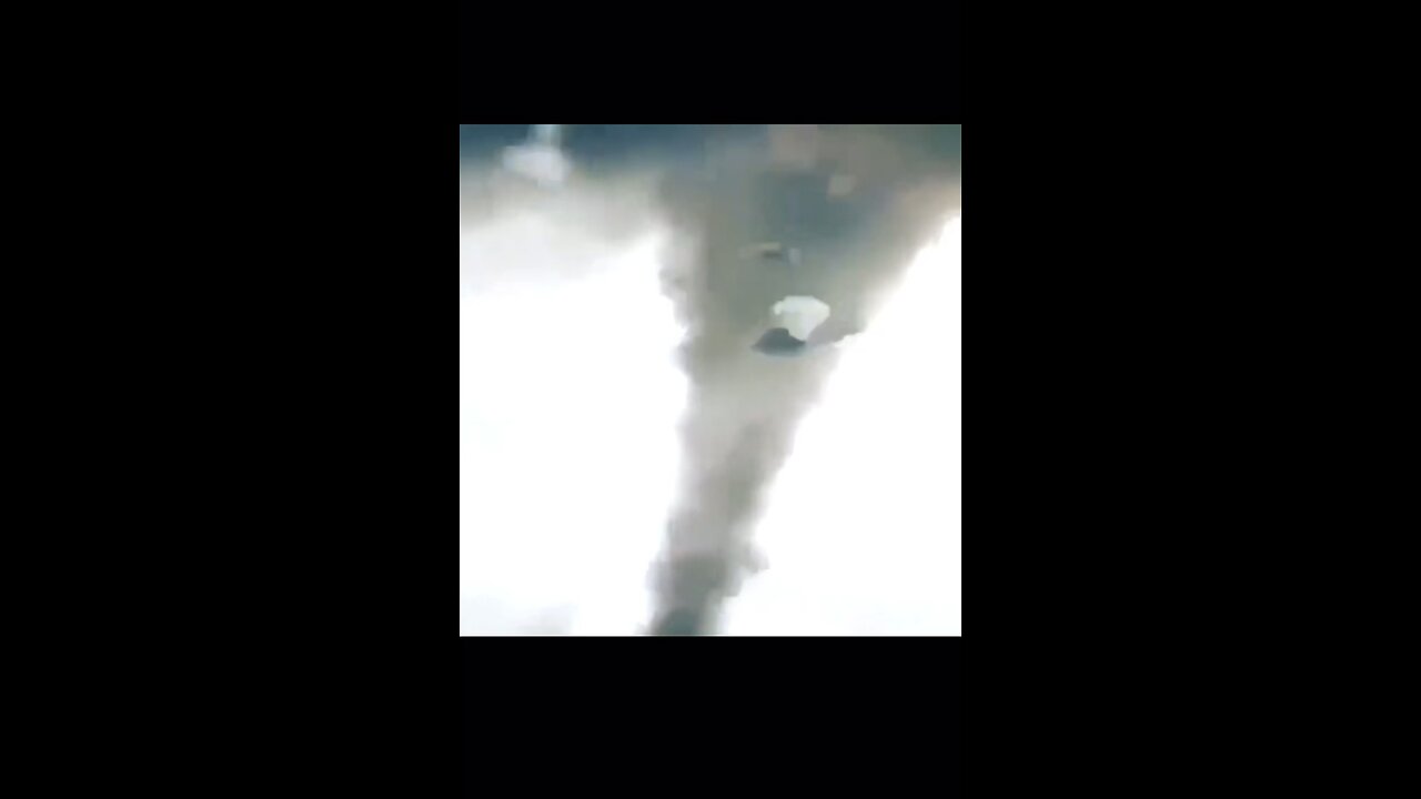 Helicopter too close to a tornado man jumps out