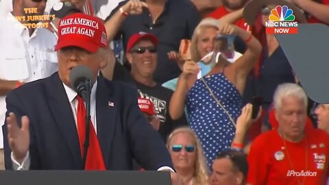 Trump Supporter Rips Up Dems' Pictures At Rally In Tampa Florida.