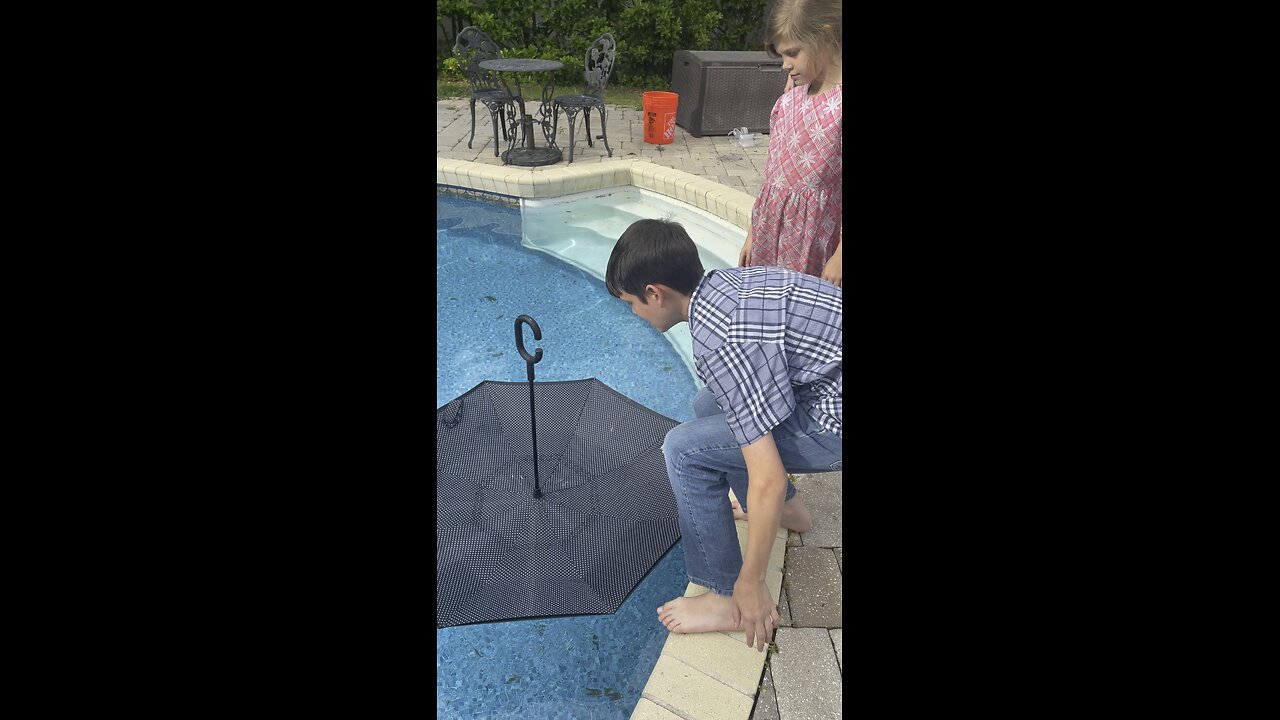 Dummy tries to float on umbrella
