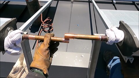 Gordons back on the roof installing the Evacuated Solar Manifold Piping.