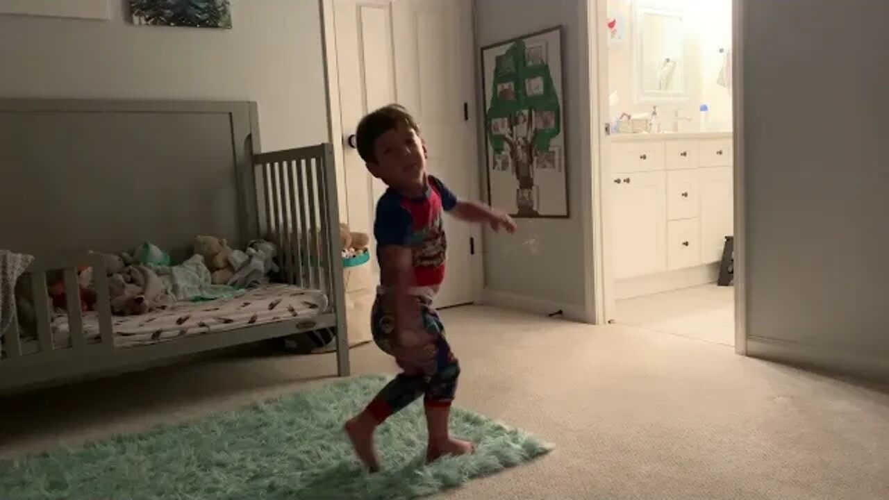 Grant dancing and spinning in room
