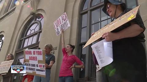 Angry over health care plan, protestors stage sit-in at Sen. Johnson's office