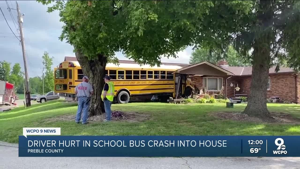 Driver hurt after school bus with 32 students on board crashes into house