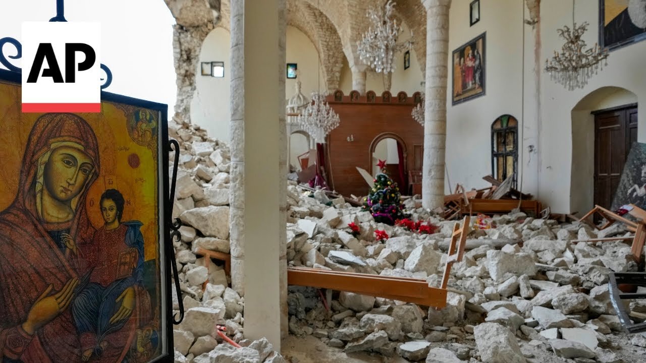 In the aftermath of war, a Christmas tree stands amid the rubble of a Lebanese church