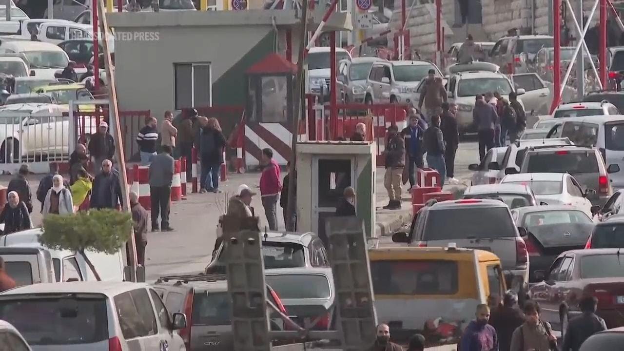 Scores of people leave Lebanon for Syria after opposition fighters capture Damascus