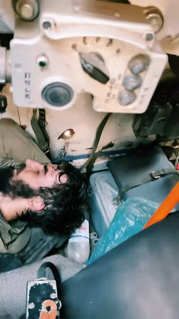 A column of several battered and some destroyed Ukrainian armored vehicles in the DPR