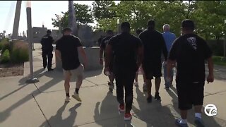 Chief White leads group down Bagley Street